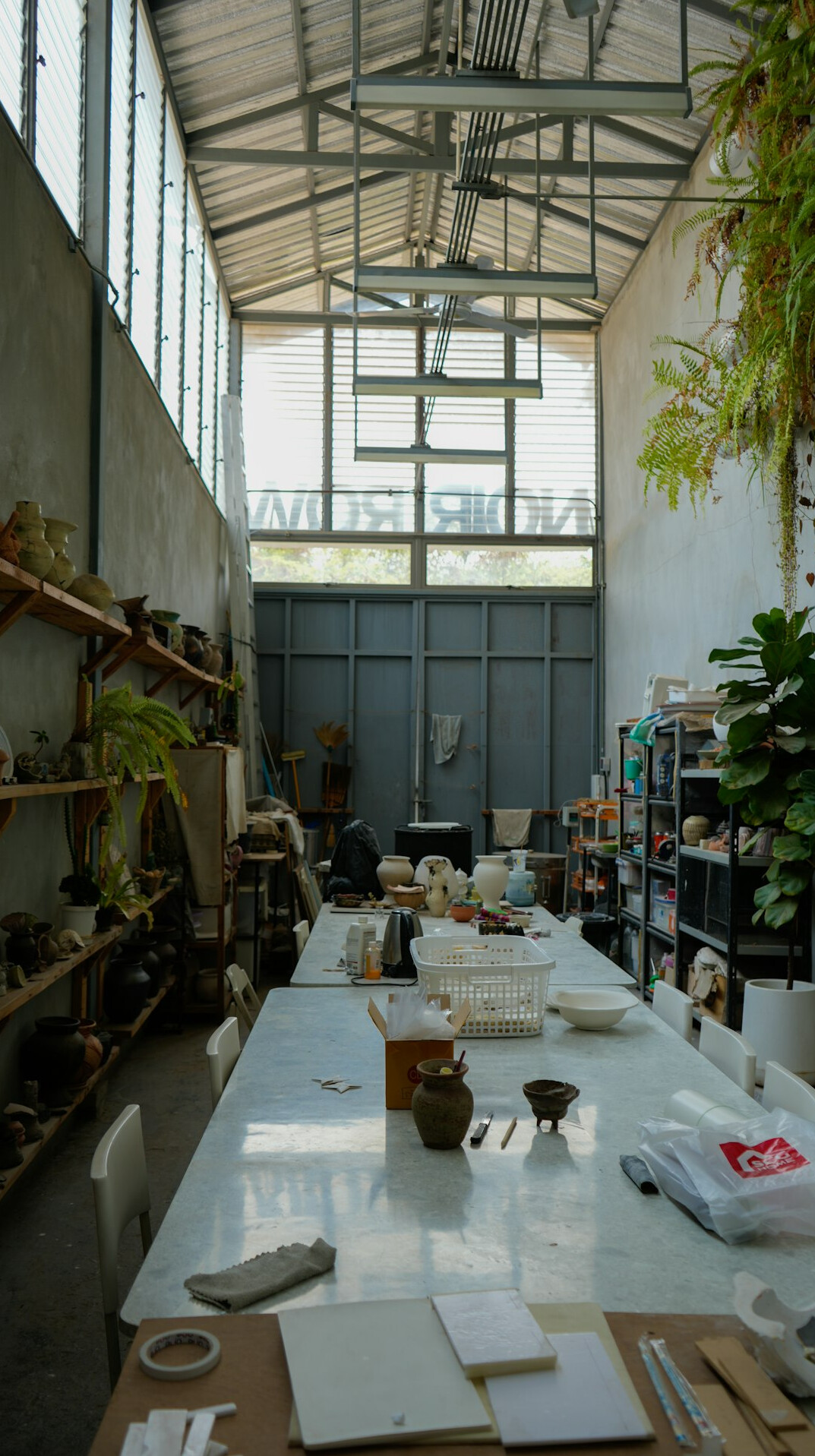 Workshop table with maps, documents and notebooks for a team